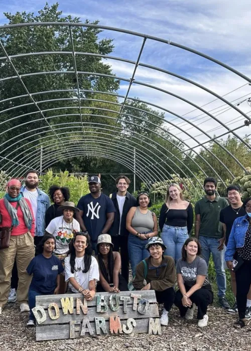 group of a dozen people on a farm