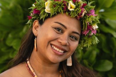 smiling woman with floral crown