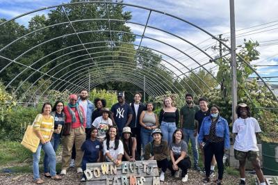 group of a dozen people on a farm