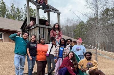 teens posed on a wooden playground