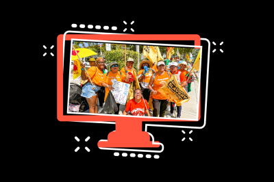 computer monitor with photo of team of people in orange