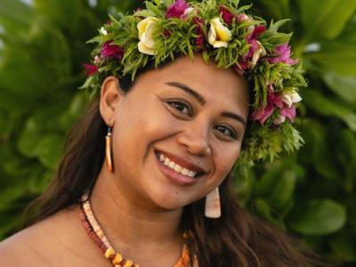smiling woman with floral crown