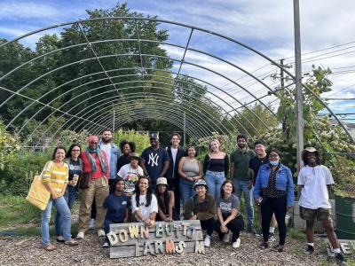 group of a dozen people on a farm