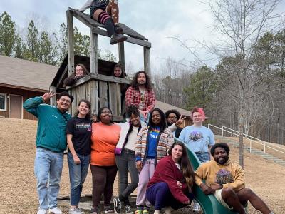 teens posed on a wooden playground