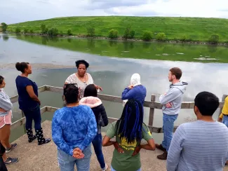 youth and instructor at a riverside 