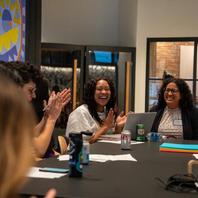 group happy working at a conference table 
