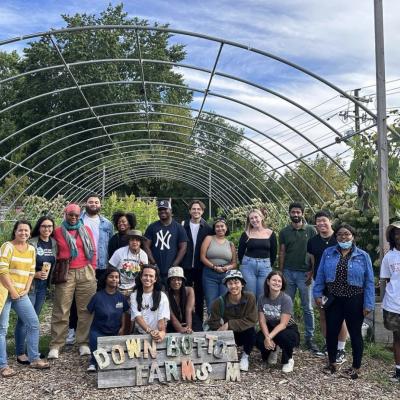 group of a dozen people on a farm